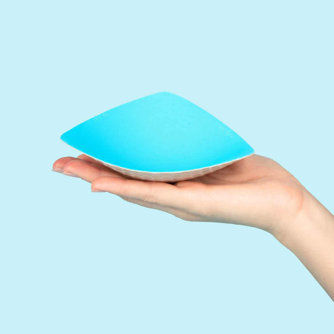 bra inserts, bra pads, triangle, honey cloudz, triangle inserts, triangle bra inserts, woman holding a triangle bra insert