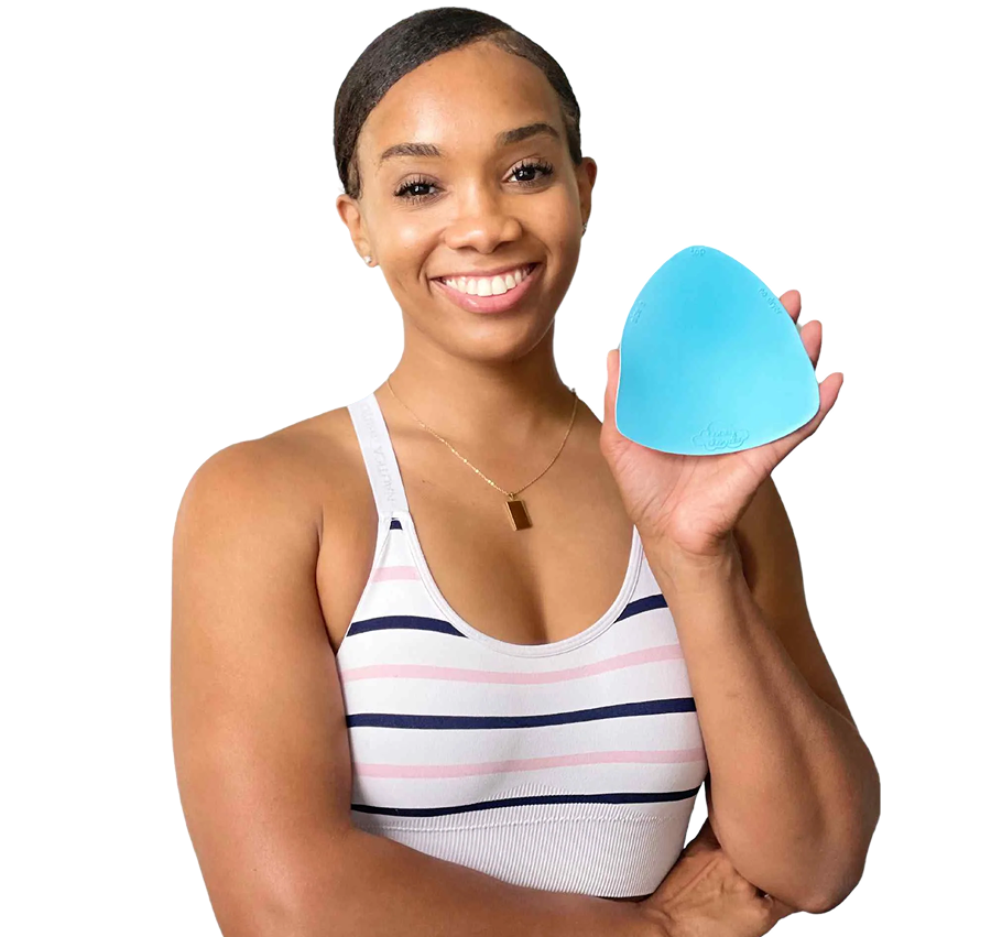 Woman smiling and holding a blue non-slip bra insert, showcasing hybrid grip technology for comfort and support.